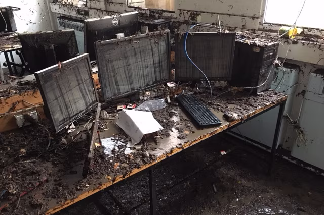School computers destroyed by floods.